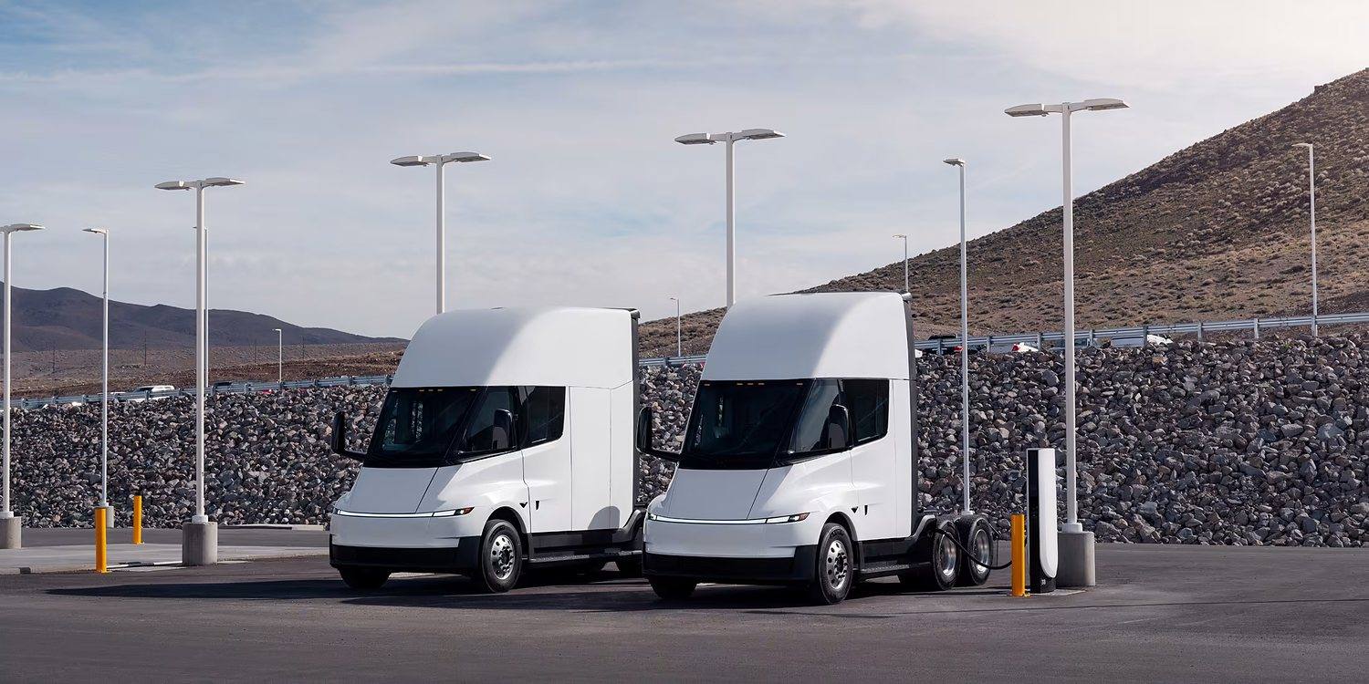 Two Tesla Semi trucks parked at a charging site